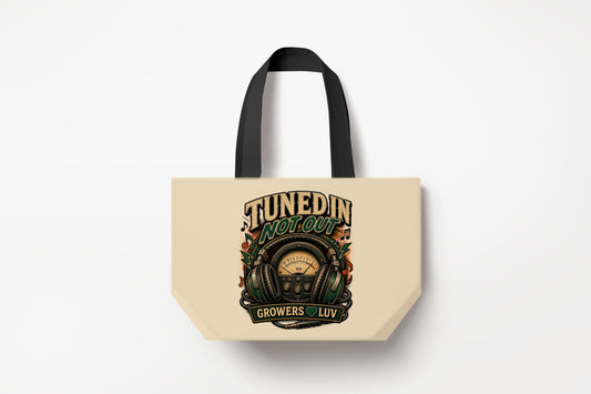 Tuned In Not Out Large Natural Tote Bag product mockup on natural tote bag